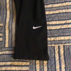 Nike black capri leggings with leg detail